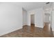 View of a spacious empty room with hardwood floors ready to be customized to your needs at 16824 Canopy Garden Dr, Port Charlotte, FL 33953
