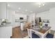 Modern kitchen with stainless steel appliances, center island, and dining area at 16824 Canopy Garden Dr, Port Charlotte, FL 33953
