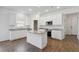 Bright kitchen with white cabinets, granite countertops, and stainless steel appliances at 16824 Canopy Garden Dr, Port Charlotte, FL 33953