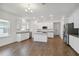 Bright kitchen with white cabinets, a center island, and stainless steel appliances at 16824 Canopy Garden Dr, Port Charlotte, FL 33953
