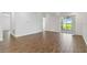 Expansive living area showcasing tile floors and a sliding glass door to the lanai at 16824 Canopy Garden Dr, Port Charlotte, FL 33953