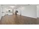 Spacious open-concept living area featuring modern wood-look floors and abundant natural light at 16824 Canopy Garden Dr, Port Charlotte, FL 33953