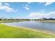 Tranquil pond view showcasing the neighborhood's serene setting at 16824 Canopy Garden Dr, Port Charlotte, FL 33953