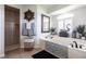 Relaxing bathroom featuring a soaking tub, tiled shower, and stylish decor at 17150 Sarong Ln, Punta Gorda, FL 33955