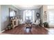 Elegant dining room showcasing hardwood floors and sophisticated furnishings under a chandelier at 17150 Sarong Ln, Punta Gorda, FL 33955