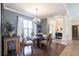Chic dining space with tiled flooring, chandelier, and plenty of natural light at 17150 Sarong Ln, Punta Gorda, FL 33955