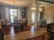 Bright dining area with decorative chandelier and large windows providing ample natural light at 17150 Sarong Ln, Punta Gorda, FL 33955