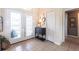 Bright foyer with stylish tile flooring, decorative doors, and an elegant console table at 17150 Sarong Ln, Punta Gorda, FL 33955