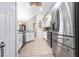 Well-lit kitchen boasts stainless appliances, white cabinetry, and tiled floors at 17150 Sarong Ln, Punta Gorda, FL 33955