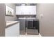 Practical laundry room featuring modern appliances, storage cabinets and a utility sink at 17150 Sarong Ln, Punta Gorda, FL 33955