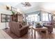 Well decorated living room featuring vaulted ceilings, stylish decor, and sliding glass doors at 17150 Sarong Ln, Punta Gorda, FL 33955