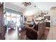 Spacious living room with hardwood floors, comfortable seating, and an open layout at 17150 Sarong Ln, Punta Gorda, FL 33955
