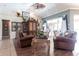 Elegant living room with vaulted ceilings, stylish decor, and sliding glass doors to the patio at 17150 Sarong Ln, Punta Gorda, FL 33955