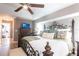 Comfortable main bedroom showcases a decorative bed frame and hardwood flooring at 17150 Sarong Ln, Punta Gorda, FL 33955