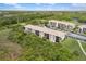 Scenic aerial shot of condo complex surrounded by lush landscaping and a tranquil body of water at 175 Kings Hwy # 625, Punta Gorda, FL 33983