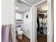 Small bathroom with toilet and a doorway leading to a closet with clothing at 175 Kings Hwy # 625, Punta Gorda, FL 33983
