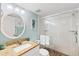Stylish bathroom features a vanity, framed mirror and modern glass enclosed shower at 175 Kings Hwy # 625, Punta Gorda, FL 33983