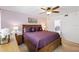 Bedroom with carpet, ceiling fan, furnishings, and view into the bathroom at 175 Kings Hwy # 625, Punta Gorda, FL 33983