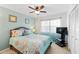 Bedroom with carpet, ceiling fan, furnishings, and a large window at 175 Kings Hwy # 625, Punta Gorda, FL 33983