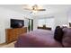 Bedroom featuring carpet, ceiling fan, furniture, and balcony access at 175 Kings Hwy # 625, Punta Gorda, FL 33983