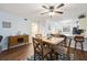 Inviting dining area featuring wood floors, stylish furniture, and modern decor at 175 Kings Hwy # 625, Punta Gorda, FL 33983