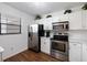 Bright kitchen featuring stainless steel appliances and white cabinetry at 175 Kings Hwy # 625, Punta Gorda, FL 33983
