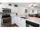 Modern kitchen with white cabinets, stainless steel appliances, and updated countertops at 175 Kings Hwy # 625, Punta Gorda, FL 33983