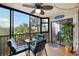Relaxing screened lanai with comfortable seating and views of tropical foliage, creating a serene outdoor space at 175 Kings Hwy # 625, Punta Gorda, FL 33983