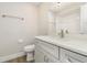 Well-lit bathroom features a modern vanity with quartz countertop and a neutral color palette at 18178 Wolbrette Cir, Port Charlotte, FL 33948