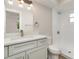 Bathroom features a modern vanity, quartz countertops, and a tiled walk-in shower at 18178 Wolbrette Cir, Port Charlotte, FL 33948