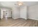 Relaxing bedroom offers wood-look floors, closet, and access to a bathroom at 18178 Wolbrette Cir, Port Charlotte, FL 33948