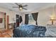 Bedroom with ceiling fan, tile flooring, and closet at 2031 Backton St, Port Charlotte, FL 33948