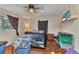 Bedroom features tile floors, a ceiling fan, and window at 2031 Backton St, Port Charlotte, FL 33948