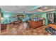 Bright kitchen with an island, stainless steel appliances, tile floors and an adjacent eat in area at 2031 Backton St, Port Charlotte, FL 33948