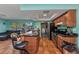 Open kitchen with central island, stainless steel appliances and laundry room access at 2031 Backton St, Port Charlotte, FL 33948