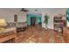 Spacious living room with terracotta tile flooring, providing a warm and inviting atmosphere at 2031 Backton St, Port Charlotte, FL 33948