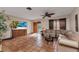 Spacious living room with a large TV, tiled floor, and a comfortable sectional sofa at 2031 Backton St, Port Charlotte, FL 33948