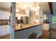 Bright kitchen with stone accents, stainless appliances, breakfast bar and white cabinetry at 21220 Pemberton Ave, Port Charlotte, FL 33952