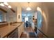 Open kitchen area with stainless appliances, stone countertops and view to breakfast nook at 21220 Pemberton Ave, Port Charlotte, FL 33952