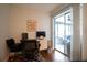 Bright home office with desk, chair, and access to outdoor living space at 21220 Pemberton Ave, Port Charlotte, FL 33952