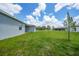 Backyard featuring a lush lawn, ideal for gardening and enjoying the outdoors at 2138 Blaser St, Punta Gorda, FL 33980