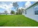 Large backyard with ample green space and privacy, perfect for outdoor entertaining at 2138 Blaser St, Punta Gorda, FL 33980
