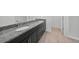 Bathroom with granite countertop, dual sinks, and tiled floors at 2138 Blaser St, Punta Gorda, FL 33980