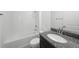 Bathroom featuring a white tub with shower, toilet, and granite vanity at 2138 Blaser St, Punta Gorda, FL 33980