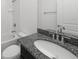 Bathroom featuring a white tub with shower, toilet, and granite vanity at 2138 Blaser St, Punta Gorda, FL 33980