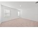 Carpeted bedroom with two windows providing natural light at 2138 Blaser St, Punta Gorda, FL 33980