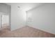 Bright bedroom with neutral carpet, white walls, and natural light from a window at 2138 Blaser St, Punta Gorda, FL 33980