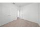 Neutral bedroom featuring carpet, closet and an entrance to hallway at 2138 Blaser St, Punta Gorda, FL 33980