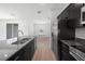 Modern kitchen featuring granite counters, stainless appliances, and an open layout at 2138 Blaser St, Punta Gorda, FL 33980