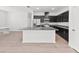 Modern kitchen with dark cabinets, granite countertops, and stainless steel appliances at 2138 Blaser St, Punta Gorda, FL 33980